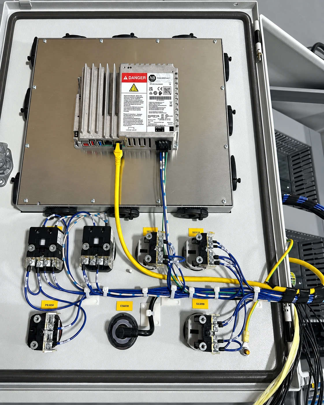 Panel door with HMI connections and identified operator-device wiring
